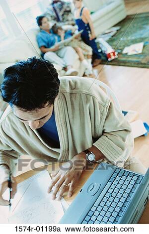 High angle view of a man writing View Large Photo Image Stock Image - High angle view of a man writing. Fotosearch