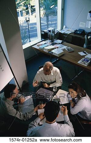High angle view of business executives in a meeting View Large Photo Image Stock Image - High angle view of business executives in a meeting. Fotosearch