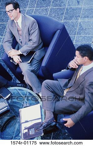 High angle view of two businessmen sitting on couches View Large Photo Image Stock Photography - High angle view of two businessmen sitting on couches. Fotosearch