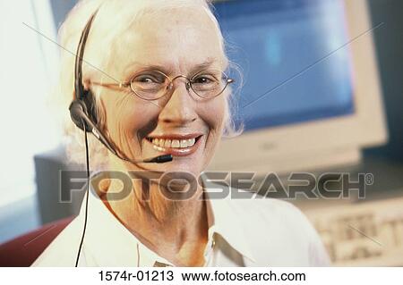 Portrait of a female customer service representative wearing a headset View Large Photo Image Stock Image - Portrait of a female customer service representative wearing a headset. Fotosearch