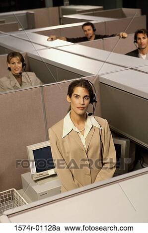 Stock Image - Portrait of customer service representatives in cubicles. Fotosearch