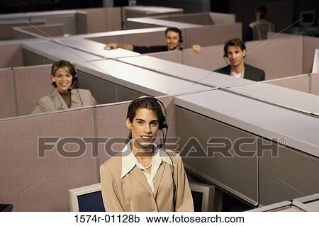 Stock Image - Portrait of customer service representatives in cubicles. Fotosearch