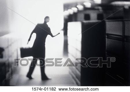 Silhouette of a businessman holding a briefcase View Large Photo Image Stock Image - Silhouette of a businessman holding a briefcase. Fotosearch