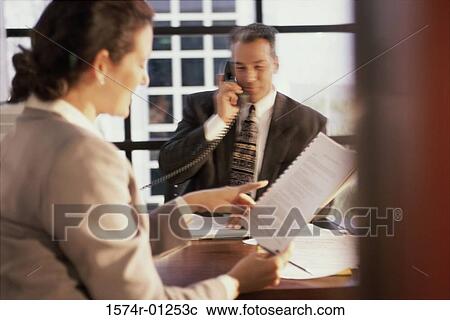 Two business executives in a discussion View Large Photo Image Stock Image - Two business executives in a discussion. Fotosearch