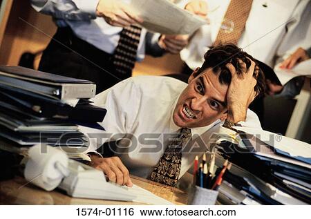 Young businessman holding his head in frustration View Large Photo Image Stock Photograph - Young businessman holding his head in frustration. Fotosearch