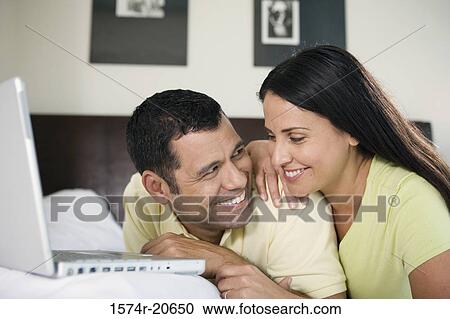 Close-up of a mature couple looking at each other and smiling View Large Photo Image Stock Image - Close-up of a mature couple looking at each other and smiling. Fotosearch