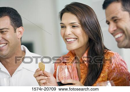 Close-up of a mid adult woman with a mature man and a mid adult man smiling View Large Photo Image Stock Photo - Close-up of a mid adult woman with a mature man and a mid adult man smiling. Fotosearch