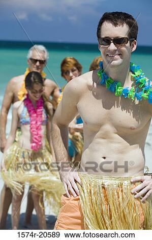 Close-up of a young man smiling on the beach View Large Photo Image Stock Photo - Close-up of a young man smiling on the beach. Fotosearch