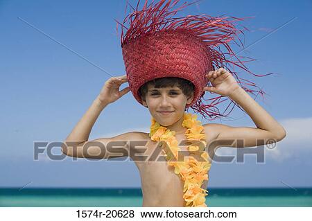 Portrait of a boy wearing a straw hat and smiling View Large Photo Image Stock Photo - Portrait of a boy wearing a straw hat and smiling. Fotosearch