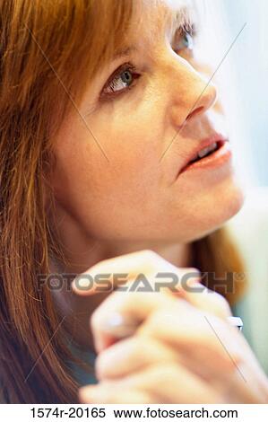 Stock Photography - Close-up of a businesswoman with her hands clasped. Fotosearch