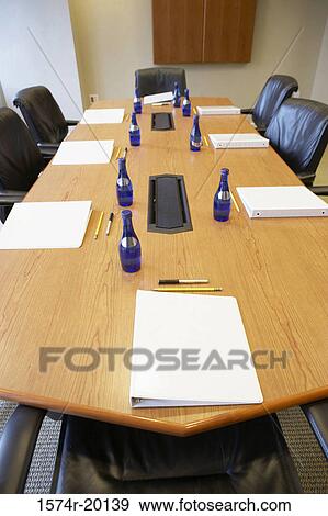 High angle view of water bottles and ring binder files on a conference table View Large Photo Image Stock Photo - High angle view of water bottles and ring binder files on a conference table. Fotosearch