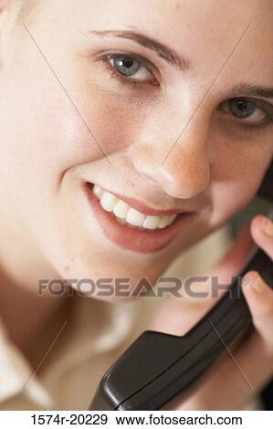 Portrait of a businesswoman talking on the telephone View Large Photo Image Stock Photo - Portrait of a businesswoman talking on the telephone. Fotosearch