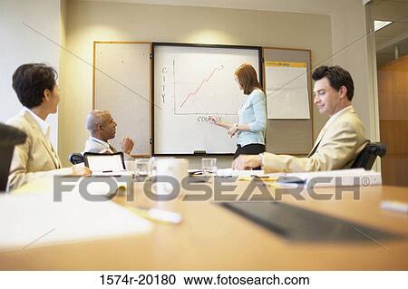 Side profile of a businesswoman giving a presentation View Large Photo Image Stock Image - Side profile of a businesswoman giving a presentation. Fotosearch