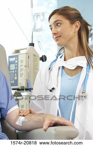 Close-up of a female doctor examining a male patient View Large Photo Image Stock Photo - Close-up of a female doctor examining a male patient. Fotosearch