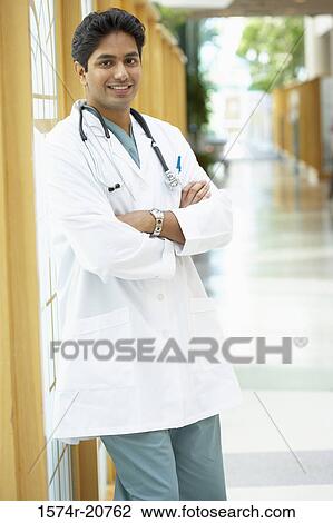 Close-up of a male doctor smiling View Large Photo Image Stock Image - Close-up of a male doctor smiling. Fotosearch
