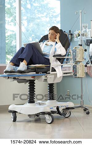Female doctor using a laptop View Large Photo Image Picture - Female doctor using a laptop. Fotosearch