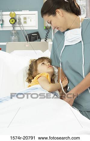 Girl and a female nurse looking at each other View Large Photo Image Stock Image - Girl and a female nurse looking at each other. Fotosearch