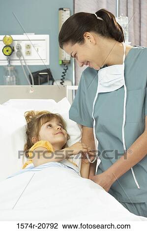 Girl and a female nurse looking at each other View Large Photo Image Stock Image - Girl and a female nurse looking at each other. Fotosearch
