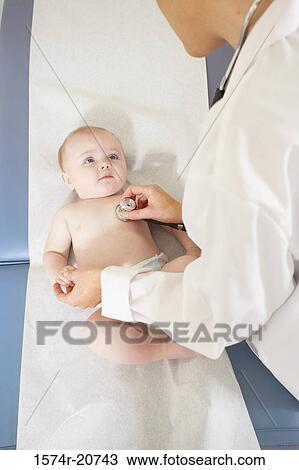 High angle view of a female doctor examining a baby boy with a stethoscope View Large Photo Image Stock Image - High angle view of a female doctor examining a baby boy with a stethoscope. Fotosearch