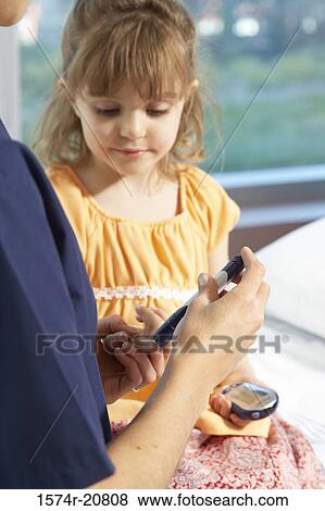 Mid section view of a female nurse taking a blood sample from a girl's finger View Large Photo Image Stock Photo - Mid section view of a female nurse taking a blood sample from a girl's finger. Fotosearch