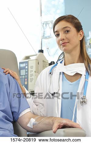 Portrait of a female doctor examining a male patient View Large Photo Image Stock Photo - Portrait of a female doctor examining a male patient. Fotosearch