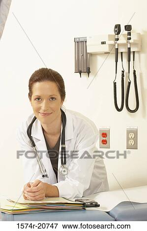Stock Photo - Portrait of a female doctor smiling. Fotosearch