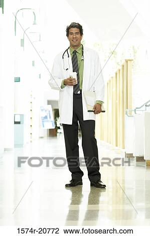 Portrait of a male doctor smiling with a stethoscope around his neck View Large Photo Image Stock Image - Portrait of a male doctor smiling with a stethoscope around his neck. Fotosearch