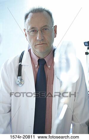 Stock Image - Portrait of a male doctor with a stethoscope around his neck. Fotosearch