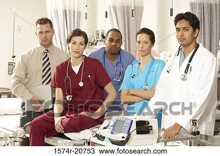 Stock Image - Portrait of three male doctors and two female doctors. Fotosearch