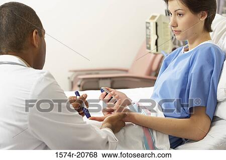 Rear view of a male doctor taking a blood sample from a female patient's finger View Large Photo Image Stock Photo - Rear view of a male doctor taking a blood sample from a female patient's finger. Fotosearch