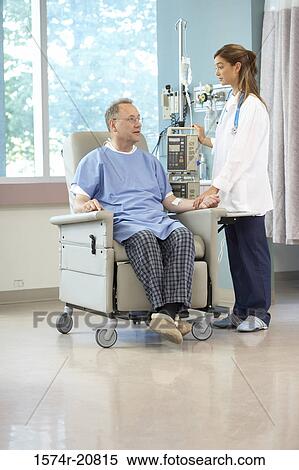 Side profile of a female doctor examining a male patient View Large Photo Image Stock Photography - Side profile of a female doctor examining a male patient. Fotosearch