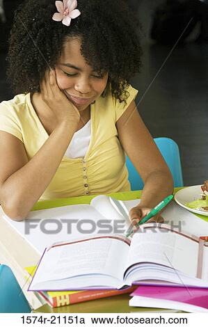 Close-up of a girl doing her homework View Large Photo Image Stock Image - Close-up of a girl doing her homework. Fotosearch