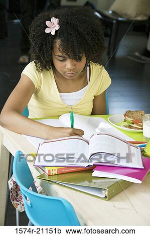 Close-up of a girl doing her homework View Large Photo Image Stock Image - Close-up of a girl doing her homework. Fotosearch