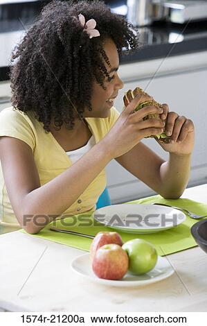 Close-up of a girl having breakfast View Large Photo Image Stock Image - Close-up of a girl having breakfast. Fotosearch