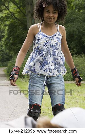 Stock Image - Portrait of a girl smiling. Fotosearch
