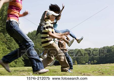 Side profile of five children running in a park View Large Photo Image Stock Image - Side profile of five children running in a park. Fotosearch