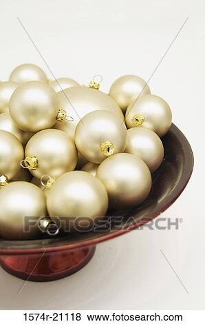 Stock Photo - Close-up of Christmas ornaments in a bowl. Fotosearch