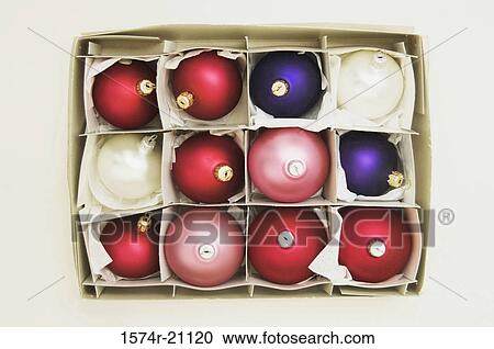High angle view of Christmas ornaments in a box View Large Photo Image Stock Image - High angle view of Christmas ornaments in a box. Fotosearch