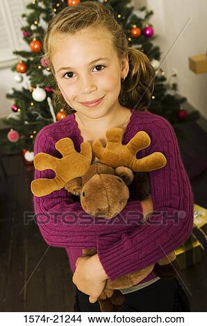 Portrait of a girl hugging a stuffed toy View Large Photo Image Picture - Portrait of a girl hugging a stuffed toy. Fotosearch
