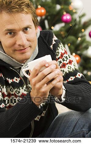 Portrait of a mid adult man holding a tea cup View Large Photo Image Stock Photo - Portrait of a mid adult man holding a tea cup. Fotosearch