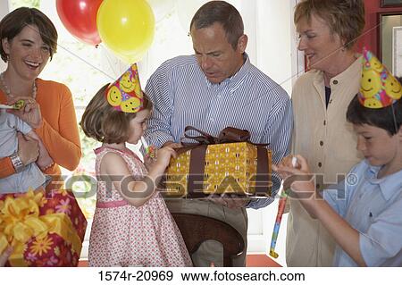 Family at a birthday party View Large Photo Image Stock Photo - Family at a birthday party. Fotosearch