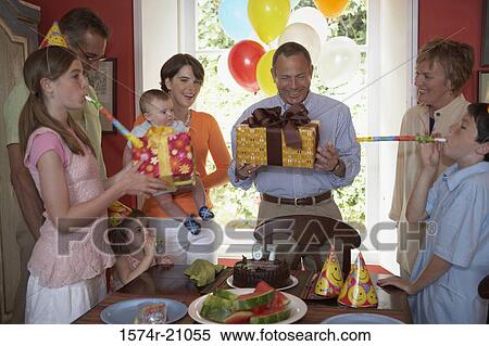 Family at a birthday party View Large Photo Image Stock Photography - Family at a birthday party. Fotosearch