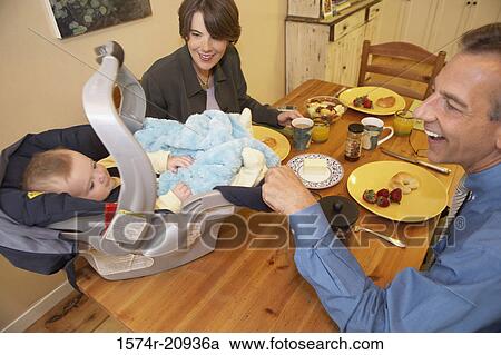 High angle view of a mid adult couple playing with their son View Large Photo Image Stock Image - High angle view of a mid adult couple playing with their son. Fotosearch