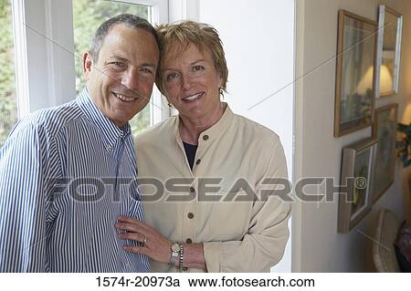 Portrait of a mature couple smiling View Large Photo Image Stock Image - Portrait of a mature couple smiling. Fotosearch