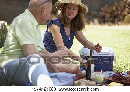 Close-up of a mature couple at a picnic View Large Photo Image Stock Image - Close-up of a mature couple at a picnic. Fotosearch