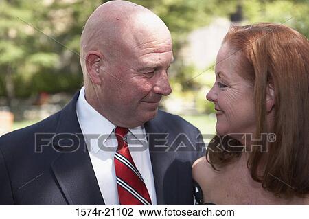 Stock Image - Close-up of a mature couple looking at each other. Fotosearch