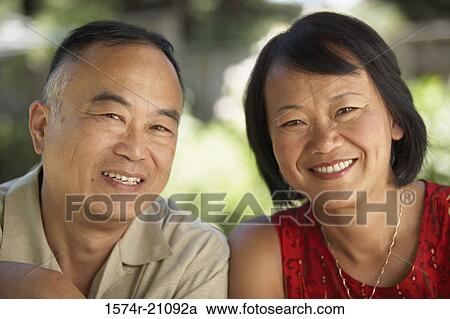 Portrait of a mature couple smiling View Large Photo Image Stock Image - Portrait of a mature couple smiling. Fotosearch
