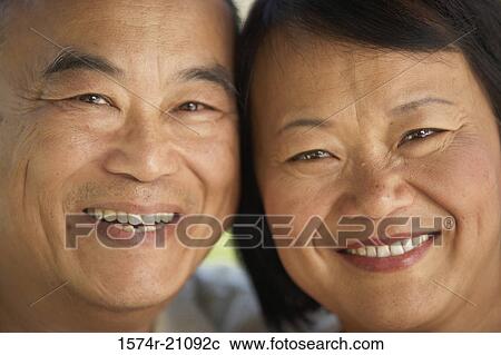 Stock Image - Portrait of a mature couple smiling. Fotosearch