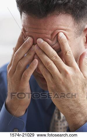 Close-up of a businessman suffering from a headache View Large Photo Image Stock Photo - Close-up of a businessman suffering from a headache. Fotosearch