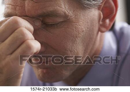 Close-up of a businessman thinking View Large Photo Image Stock Image - Close-up of a businessman thinking. Fotosearch